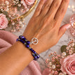 Peaceful Reign Purple Beaded Memory Wire Bracelet with Peace Sign Charm
